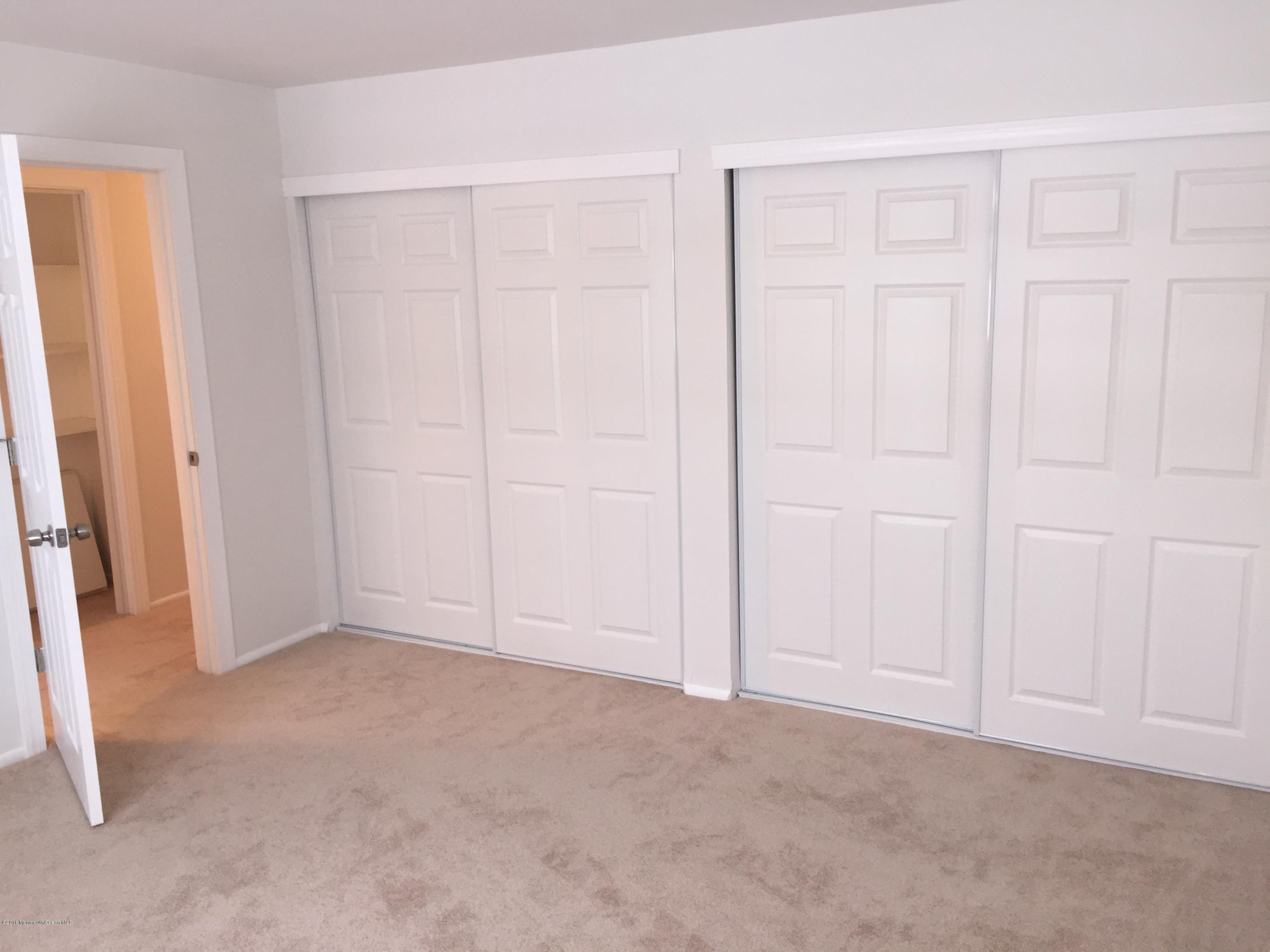313 Sawmill Road, Unit 58 Brick, NJ 08724 - Photo 7 of 9 an empty room with windows