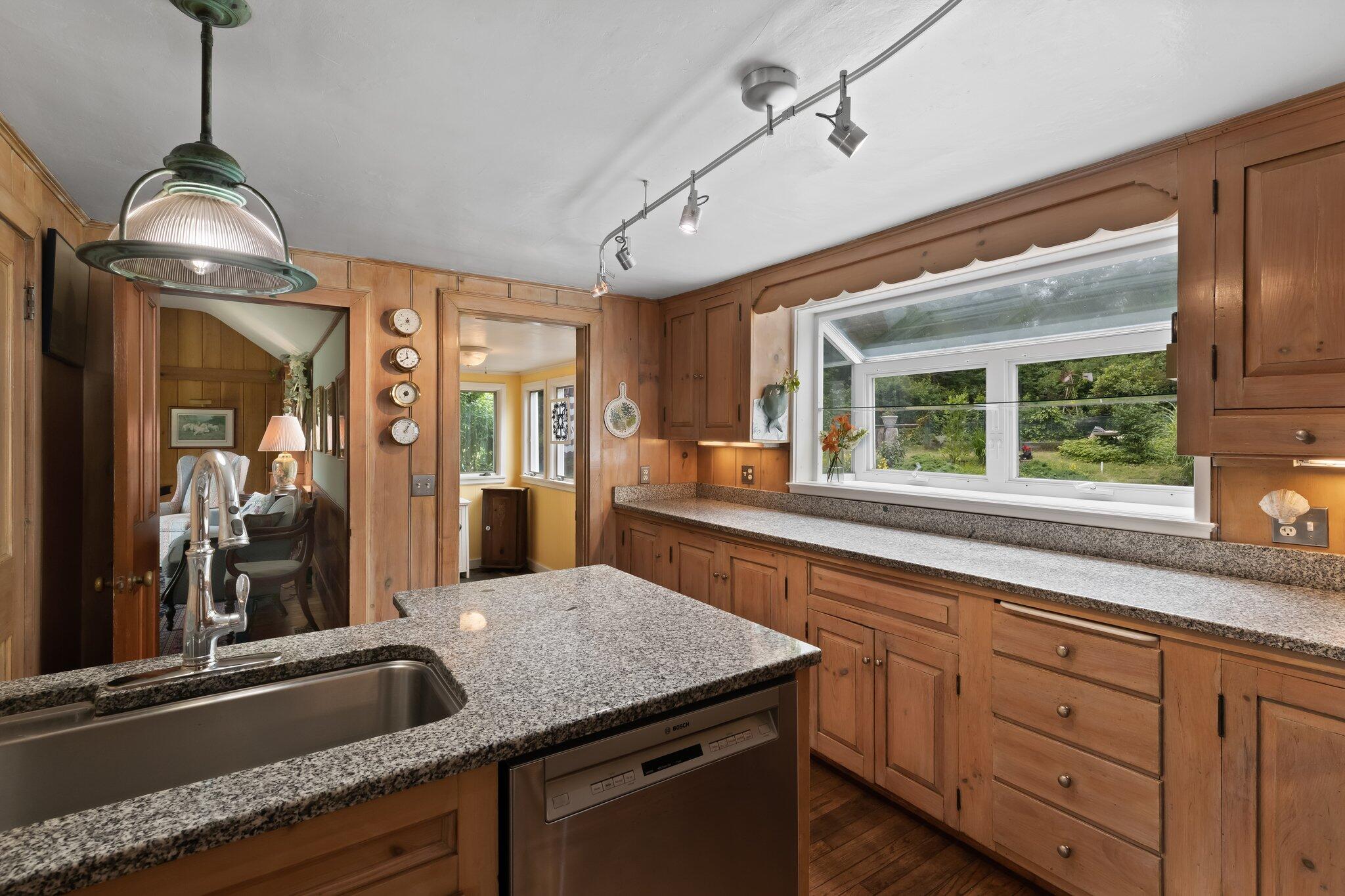 152 Monument Road Orleans, MA 02653 - Photo 14 of 40 a kitchen with granite countertop stainless steel appliances sink and window