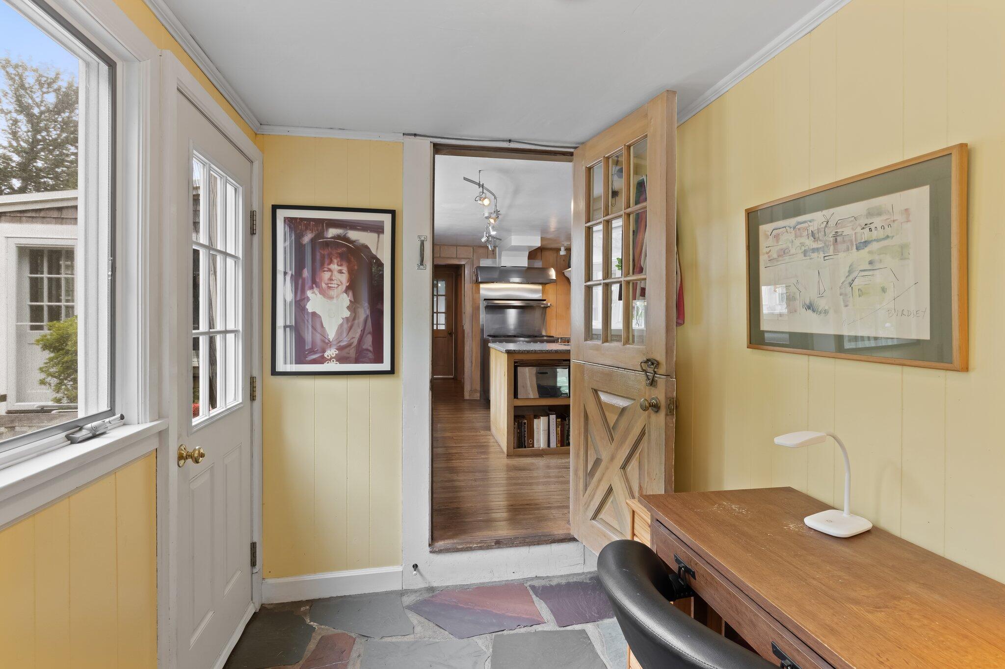 152 Monument Road Orleans, MA 02653 - Photo 16 of 40 a view of a workspace with furniture and a window