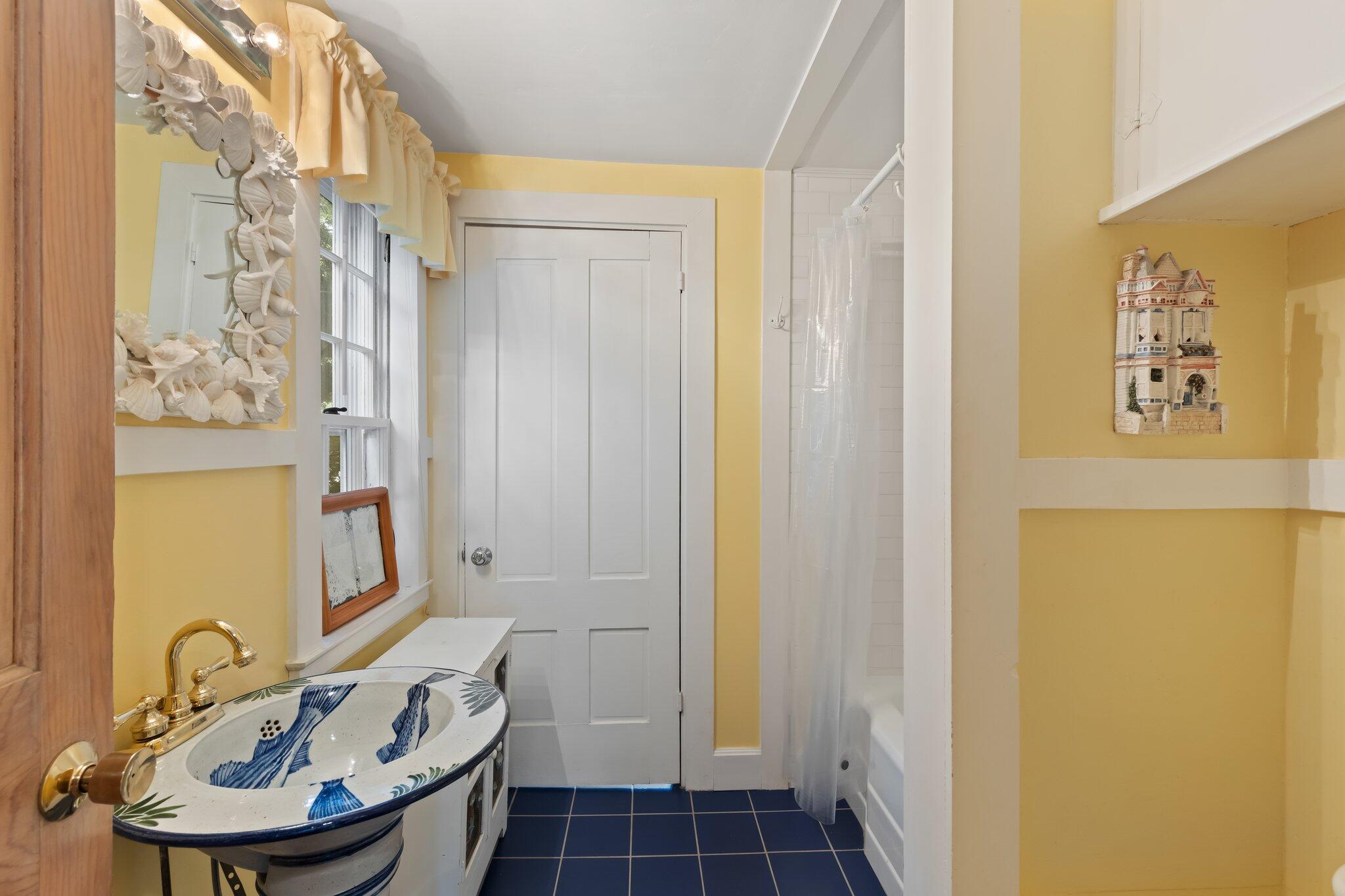 152 Monument Road Orleans, MA 02653 - Photo 18 of 40 a bathroom with a sink and a mirror