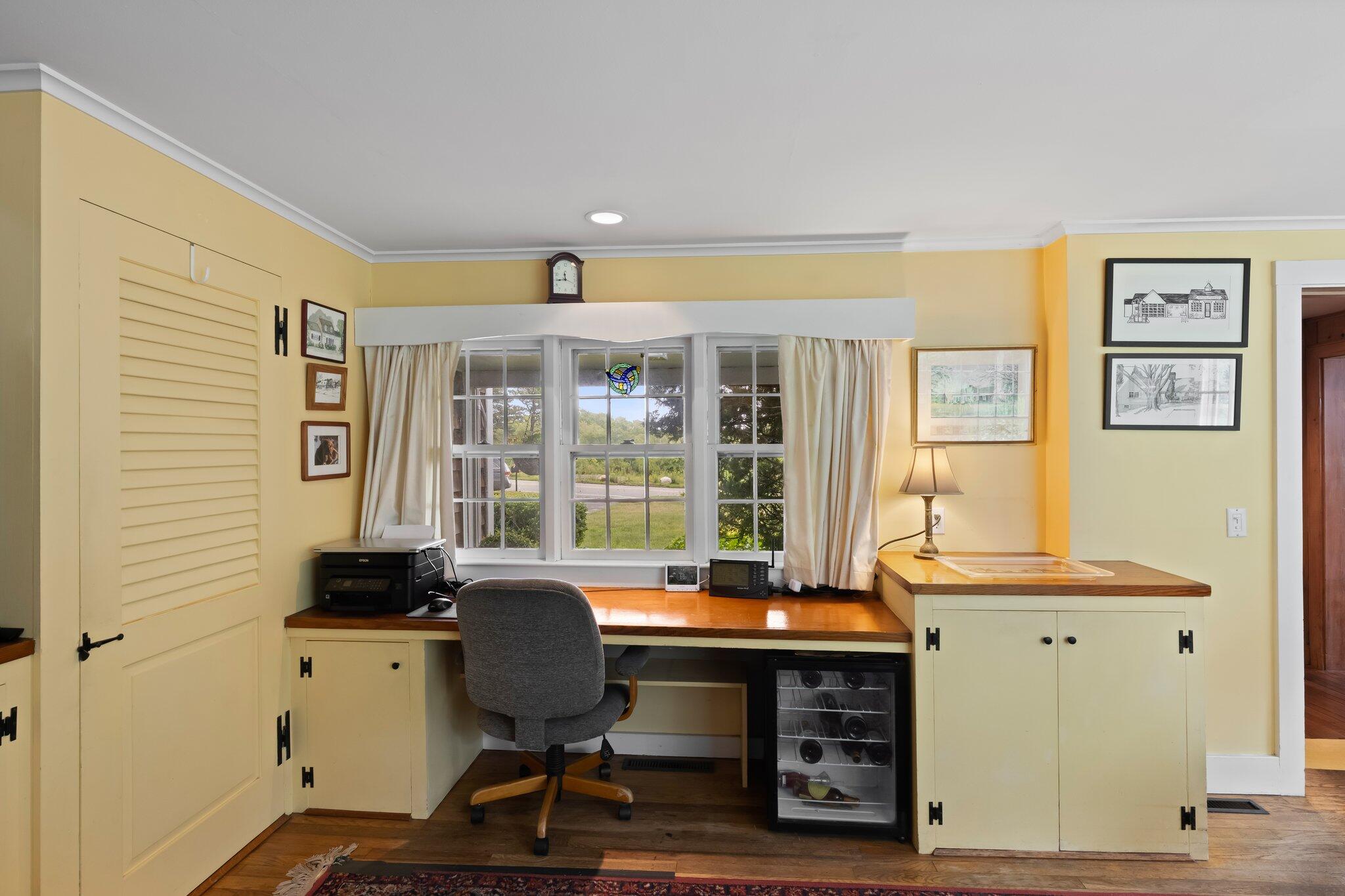 152 Monument Road Orleans, MA 02653 - Photo 19 of 40 a view of a workspace with furniture and a window