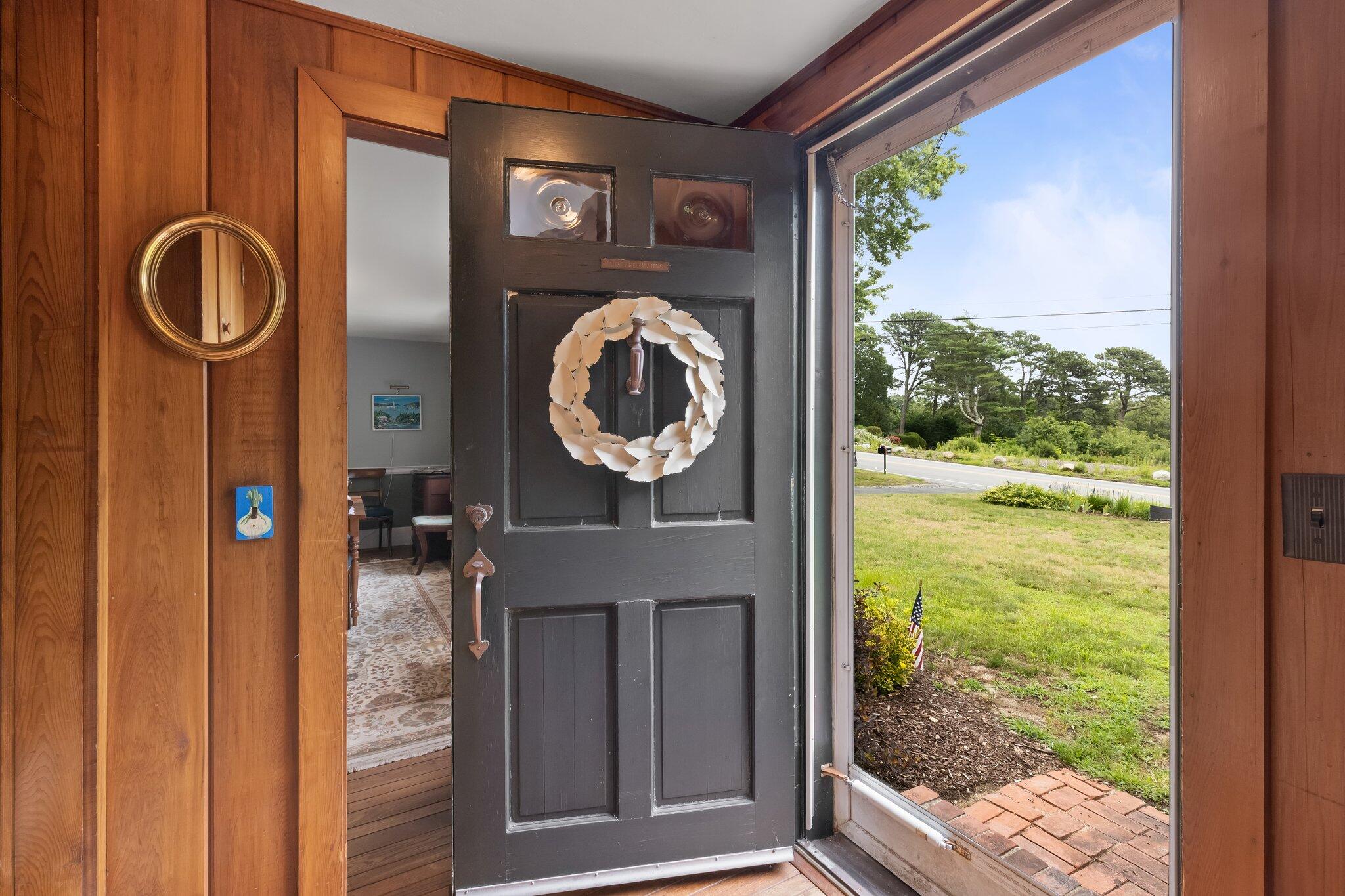 152 Monument Road Orleans, MA 02653 - Photo 2 of 40 a picture of a door and a table