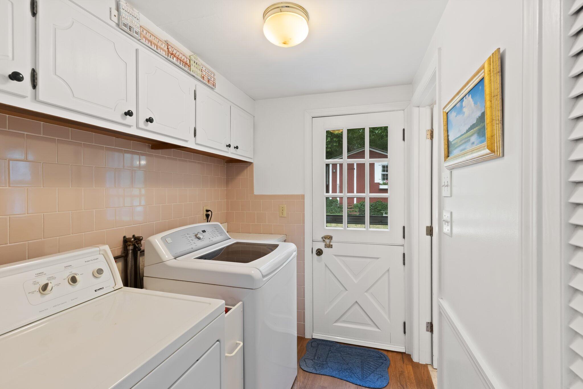 152 Monument Road Orleans, MA 02653 - Photo 25 of 40 a view of storage and utility room with washer and dryer