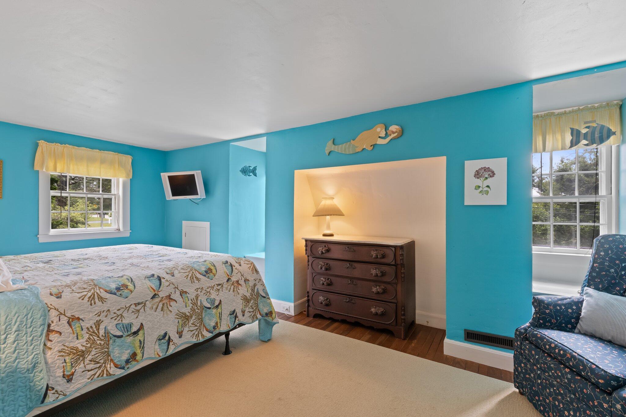 152 Monument Road Orleans, MA 02653 - Photo 29 of 40 a bedroom with a bed and furniture
