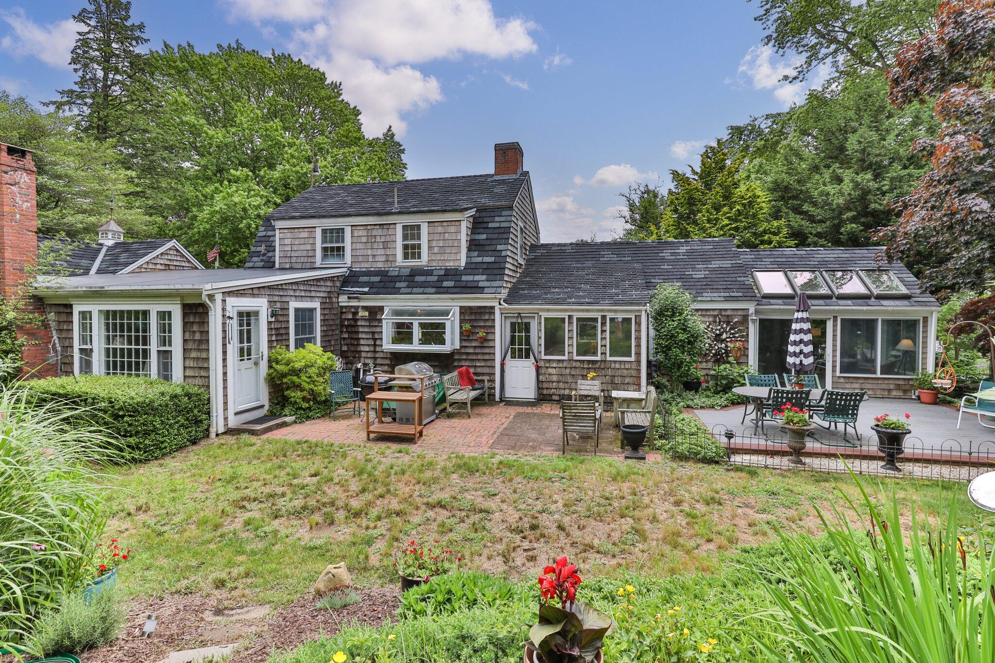 152 Monument Road Orleans, MA 02653 - Photo 32 of 40 a front view of house with yard and outdoor seating