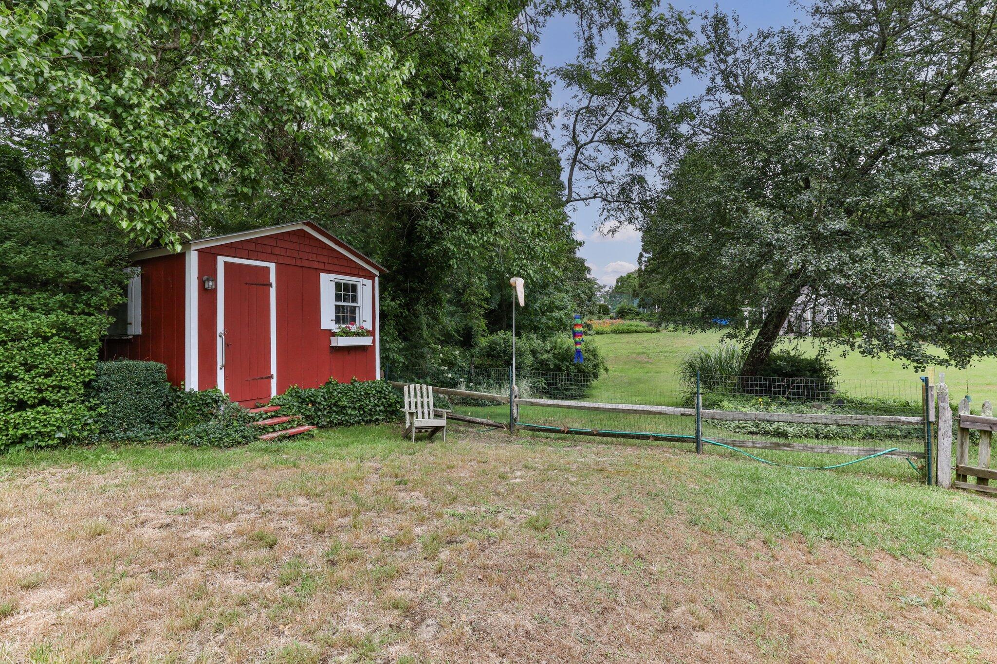 152 Monument Road Orleans, MA 02653 - Photo 37 of 40 a view of a house with a yard