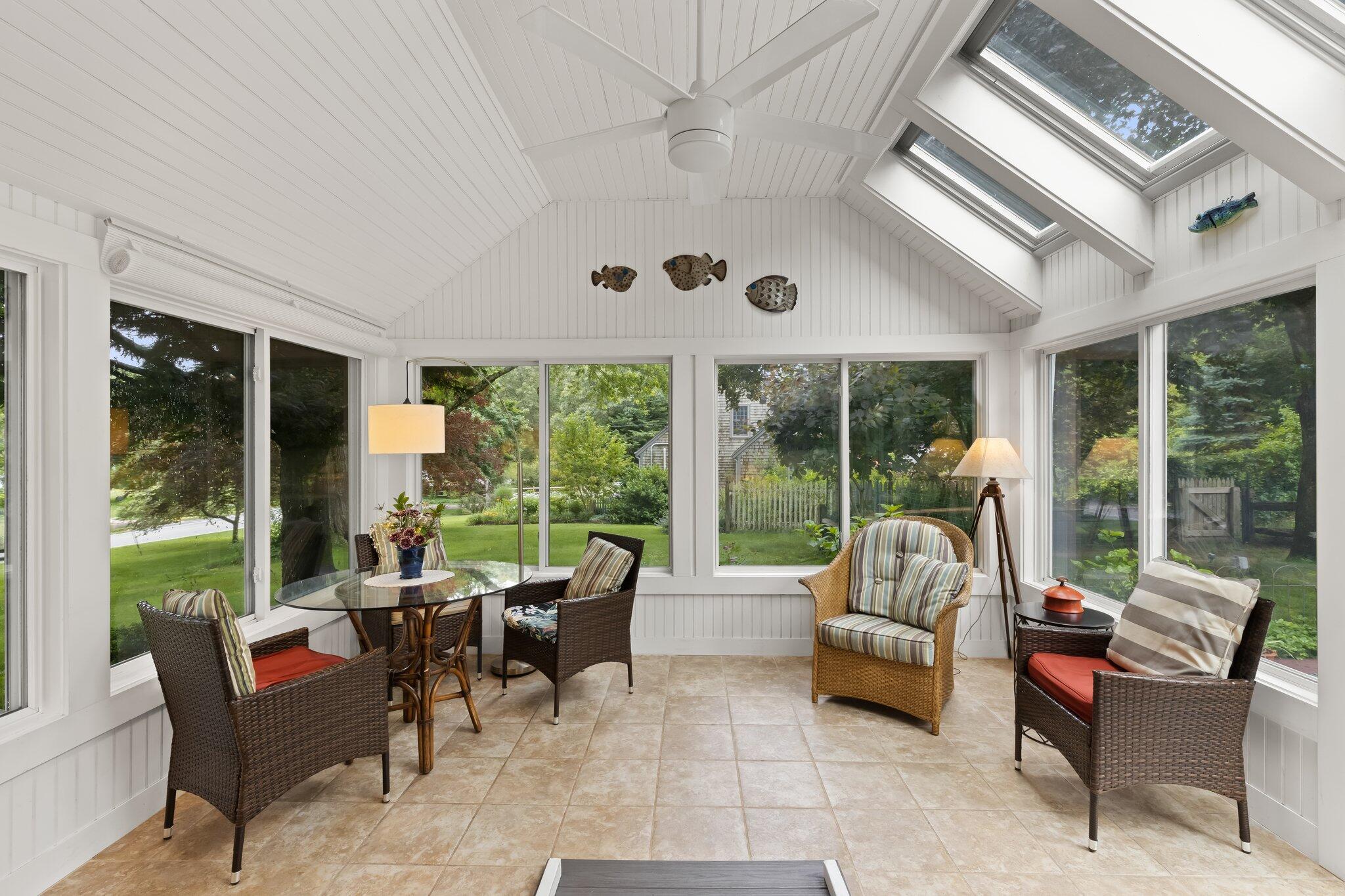 152 Monument Road Orleans, MA 02653 - Photo 5 of 40 a living room with furniture and a large window