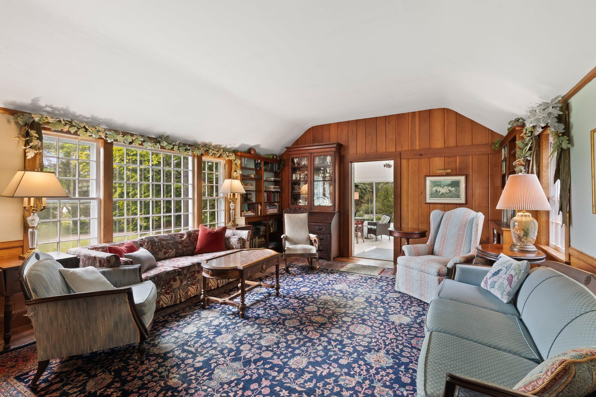 152 Monument Road Orleans, MA 02653 - Photo 10 of 40 a living room with furniture and a large window