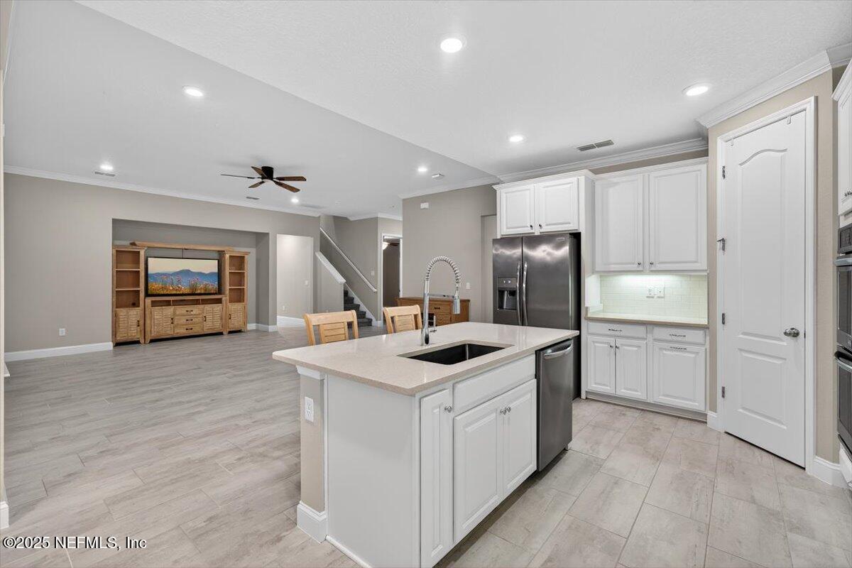 178 Antolin Way St. Augustine, FL 32095 - Photo 14 of 107 a kitchen with a sink and stove