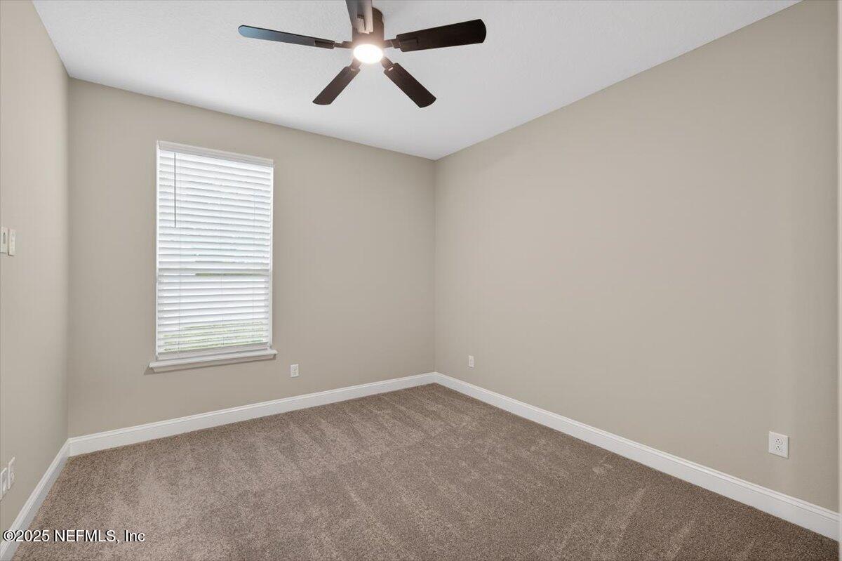 178 Antolin Way St. Augustine, FL 32095 - Photo 27 of 107 an empty room with a window and a fan