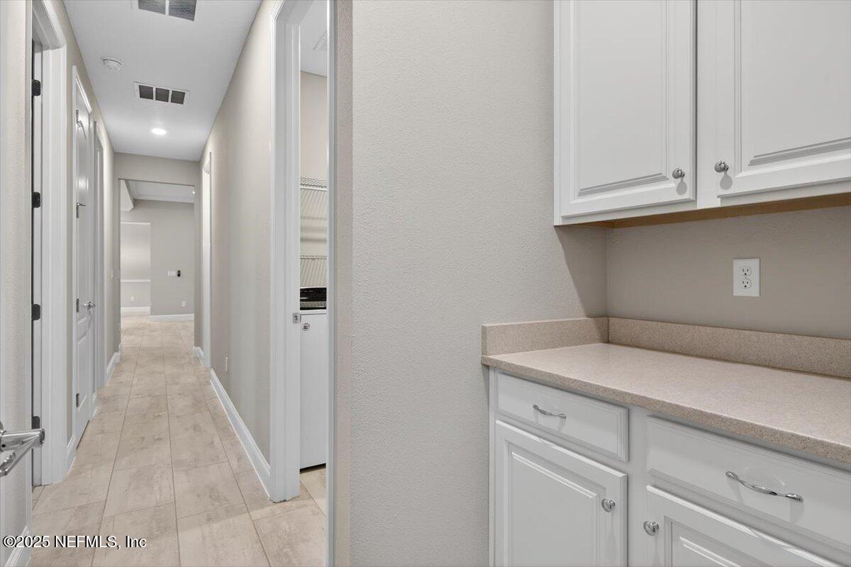178 Antolin Way St. Augustine, FL 32095 - Photo 36 of 107 a view of a kitchen with white cabinets