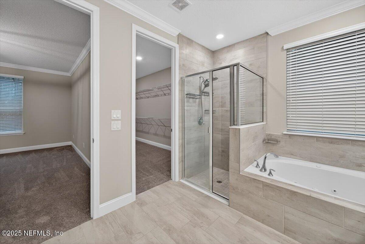 178 Antolin Way St. Augustine, FL 32095 - Photo 47 of 107 a bathroom with a shower and a tub