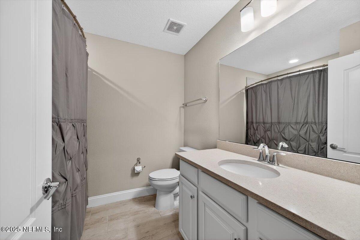 178 Antolin Way St. Augustine, FL 32095 - Photo 51 of 107 a bathroom with a granite countertop sink toilet and shower