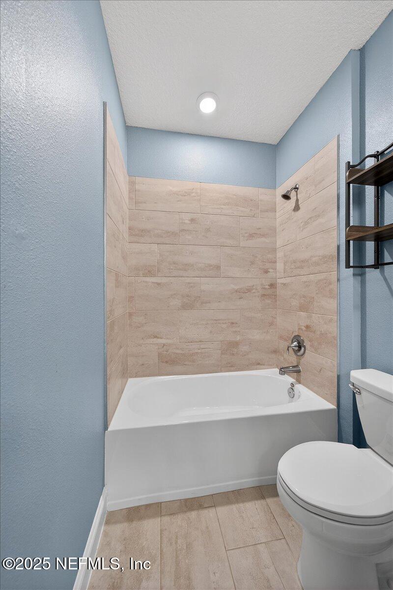 178 Antolin Way St. Augustine, FL 32095 - Photo 55 of 107 a bathroom with a toilet and a bathtub