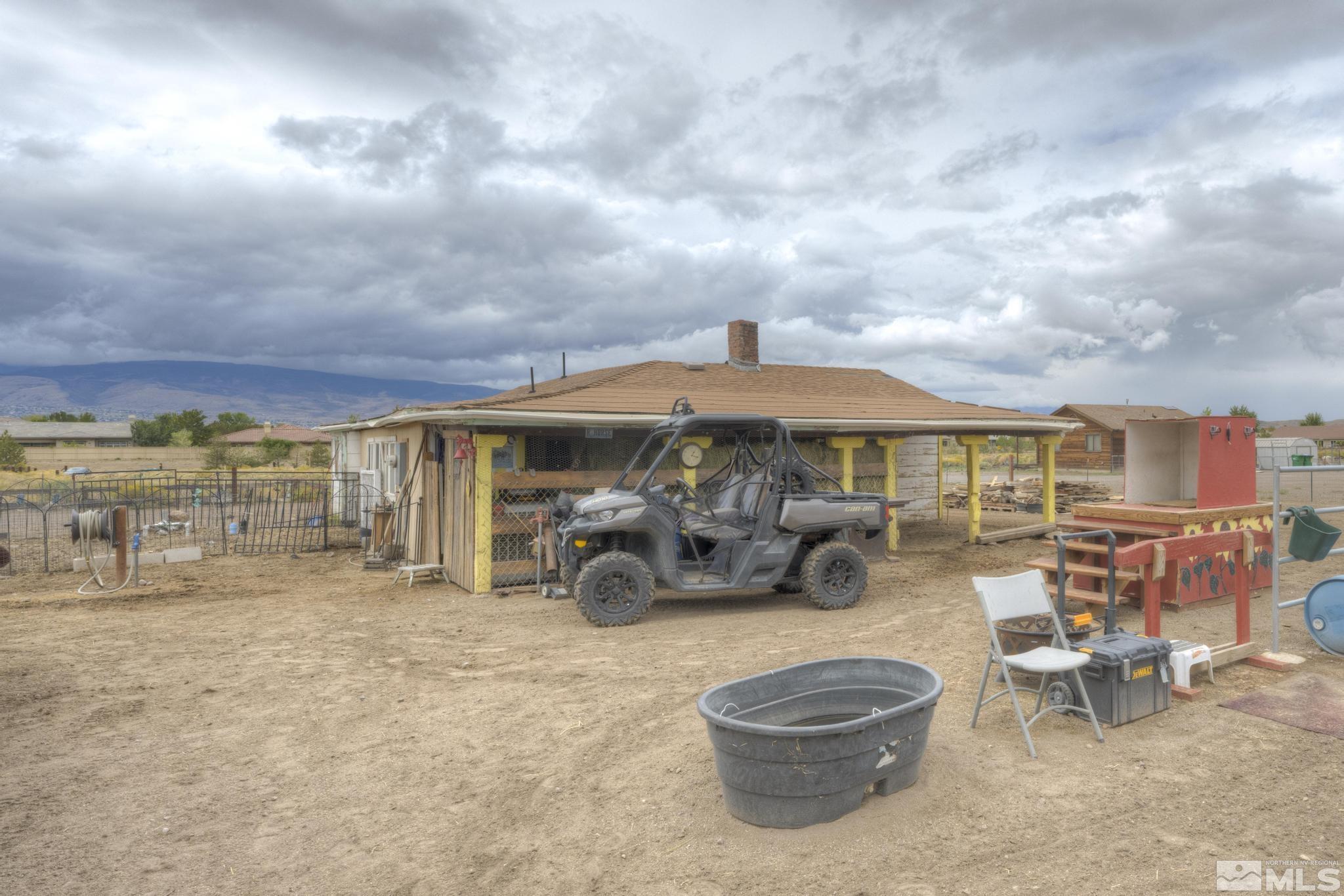 8250 Desert Way Reno, NV 89521 - Photo 8 of 32 a view of a patio with table and chairs under an umbrella