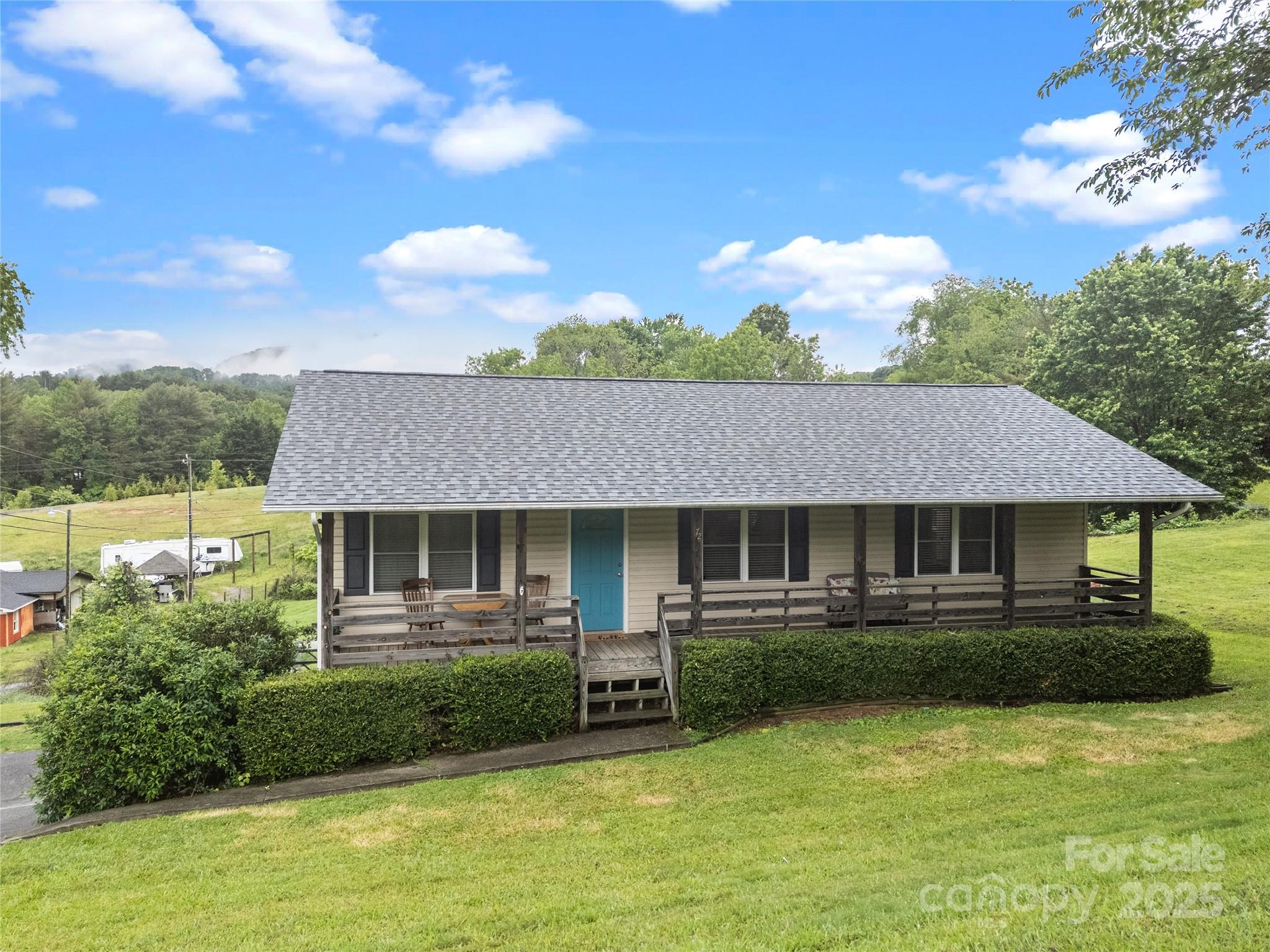 a front view of a house with a yard table and chairs