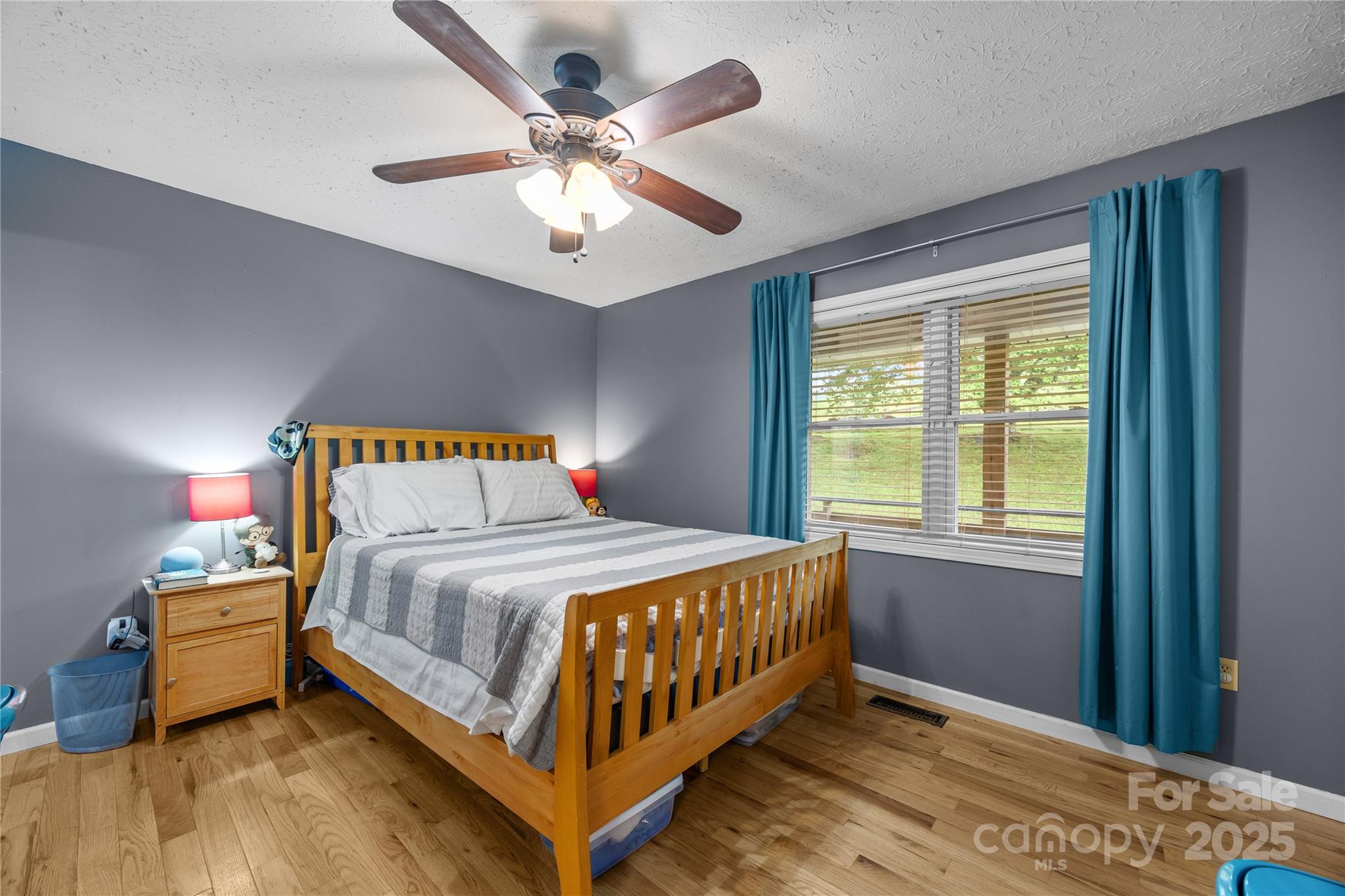 72 Sovereign Circle Clyde, NC 28721 - Photo 12 of 21 a bedroom with a bed and window