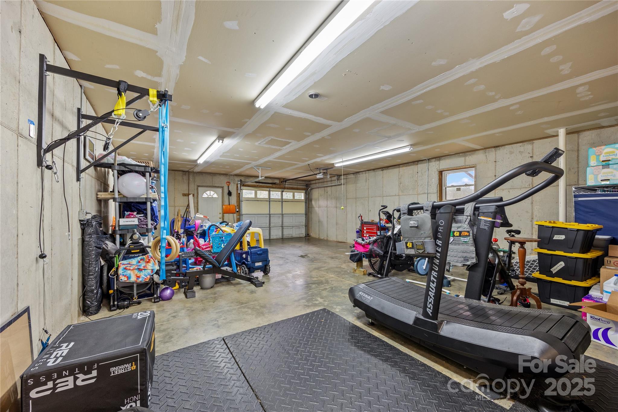 72 Sovereign Circle Clyde, NC 28721 - Photo 21 of 21 a view of a garage with a bike