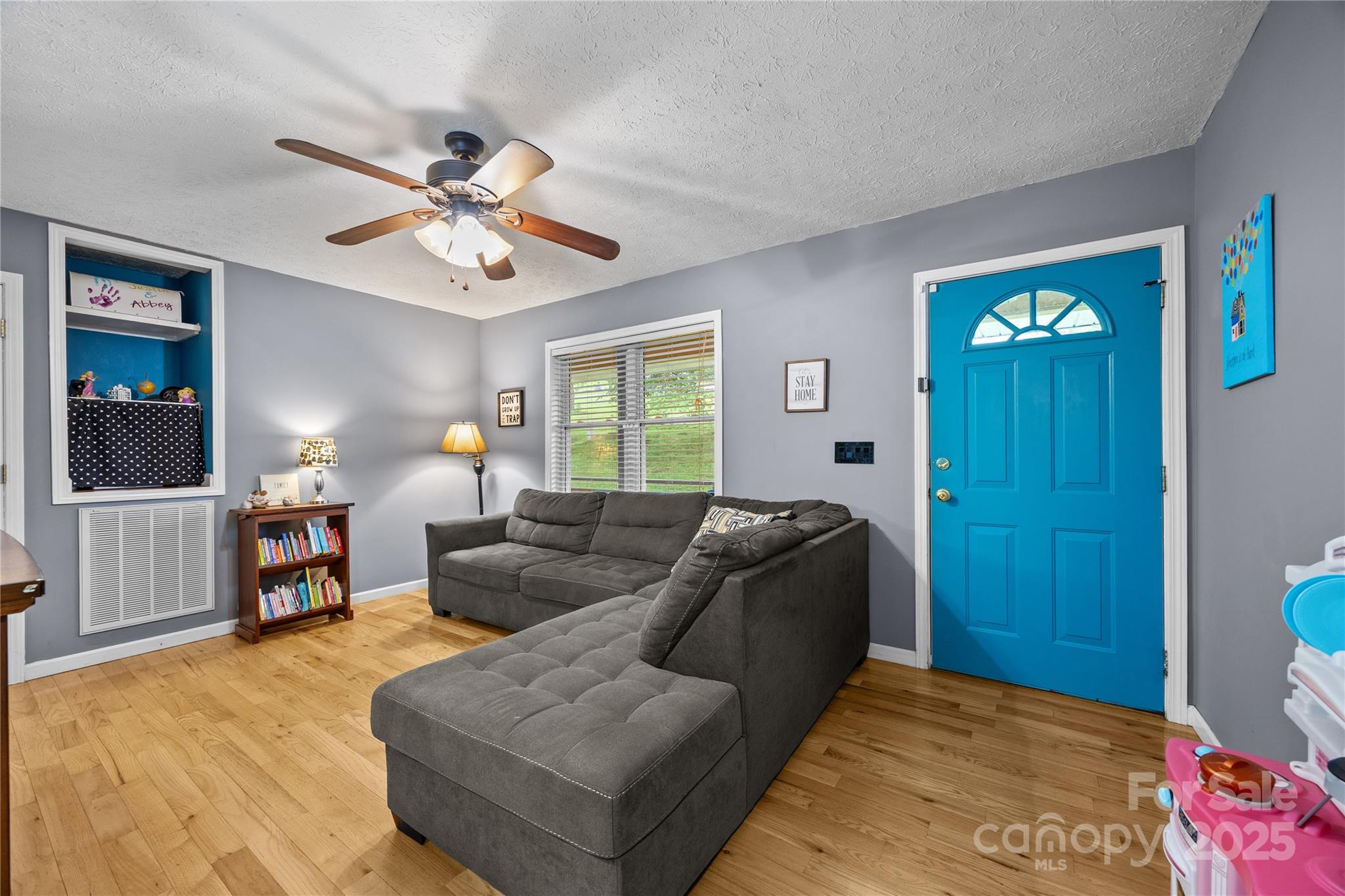 72 Sovereign Circle Clyde, NC 28721 - Photo 6 of 21 a living room with furniture and a flat screen tv