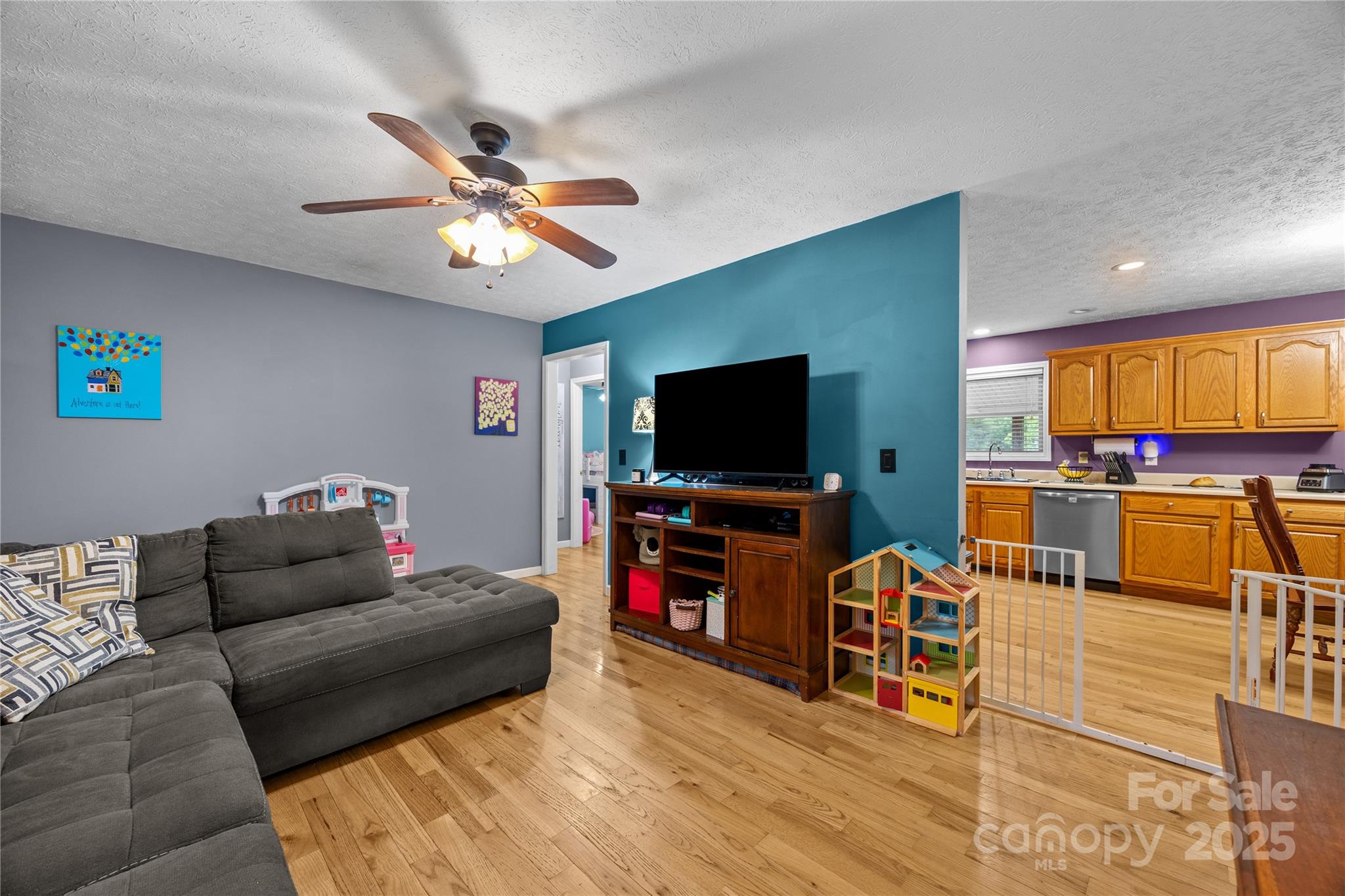 72 Sovereign Circle Clyde, NC 28721 - Photo 7 of 21 a living room with furniture and a flat screen tv