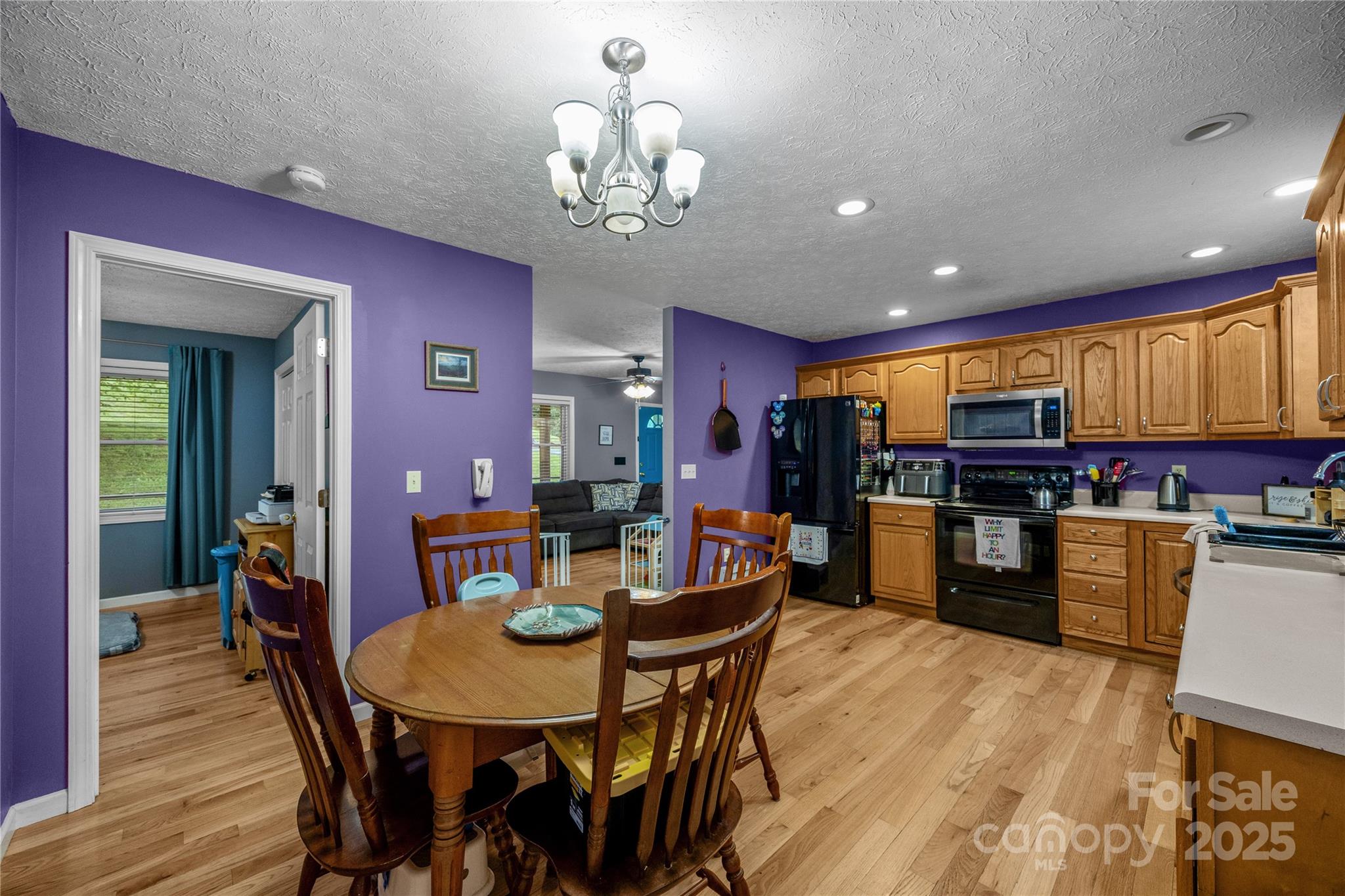72 Sovereign Circle Clyde, NC 28721 - Photo 8 of 21 a view of a dining room with furniture and wooden floor