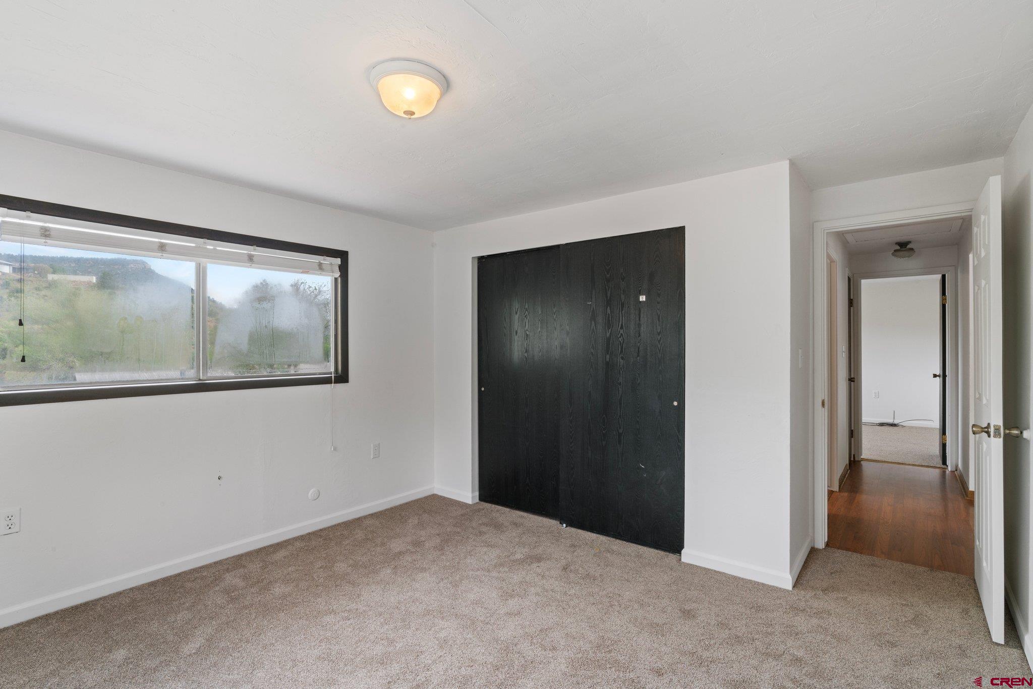 2913 Richard Drive Durango, CO 81301 - Photo 13 of 35 a view of an empty room with window and bathroom