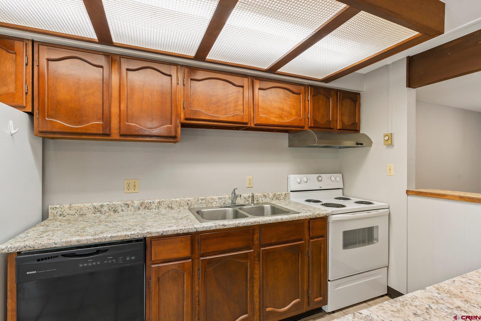2913 Richard Drive Durango, CO 81301 - Photo 18 of 35 a kitchen with stainless steel appliances granite countertop a sink and cabinets