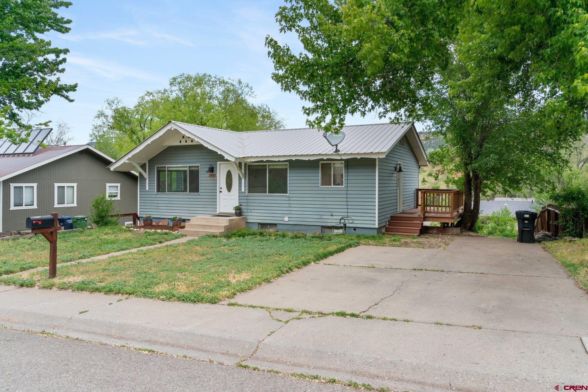 2913 Richard Drive Durango, CO 81301 - Photo 31 of 35 a front view of a house with a garden