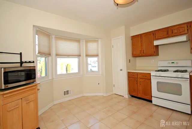 a view of wooden floor in an empty room