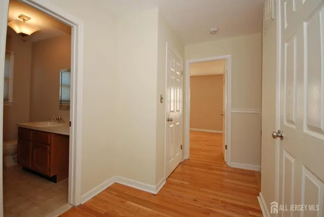 a bathroom with a sink a toilet and bathtub