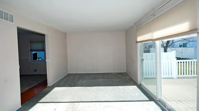 a view of a room with a large window