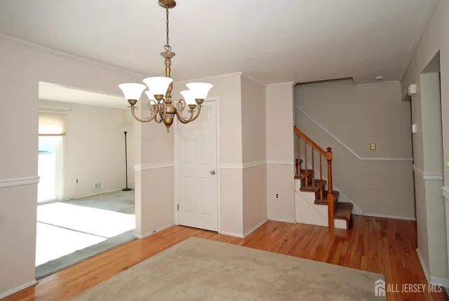 a view of a room with window and stairs