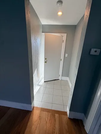wooden floor with a kitchen