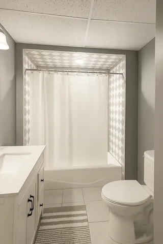 a bathroom with a sink a toilet and tub