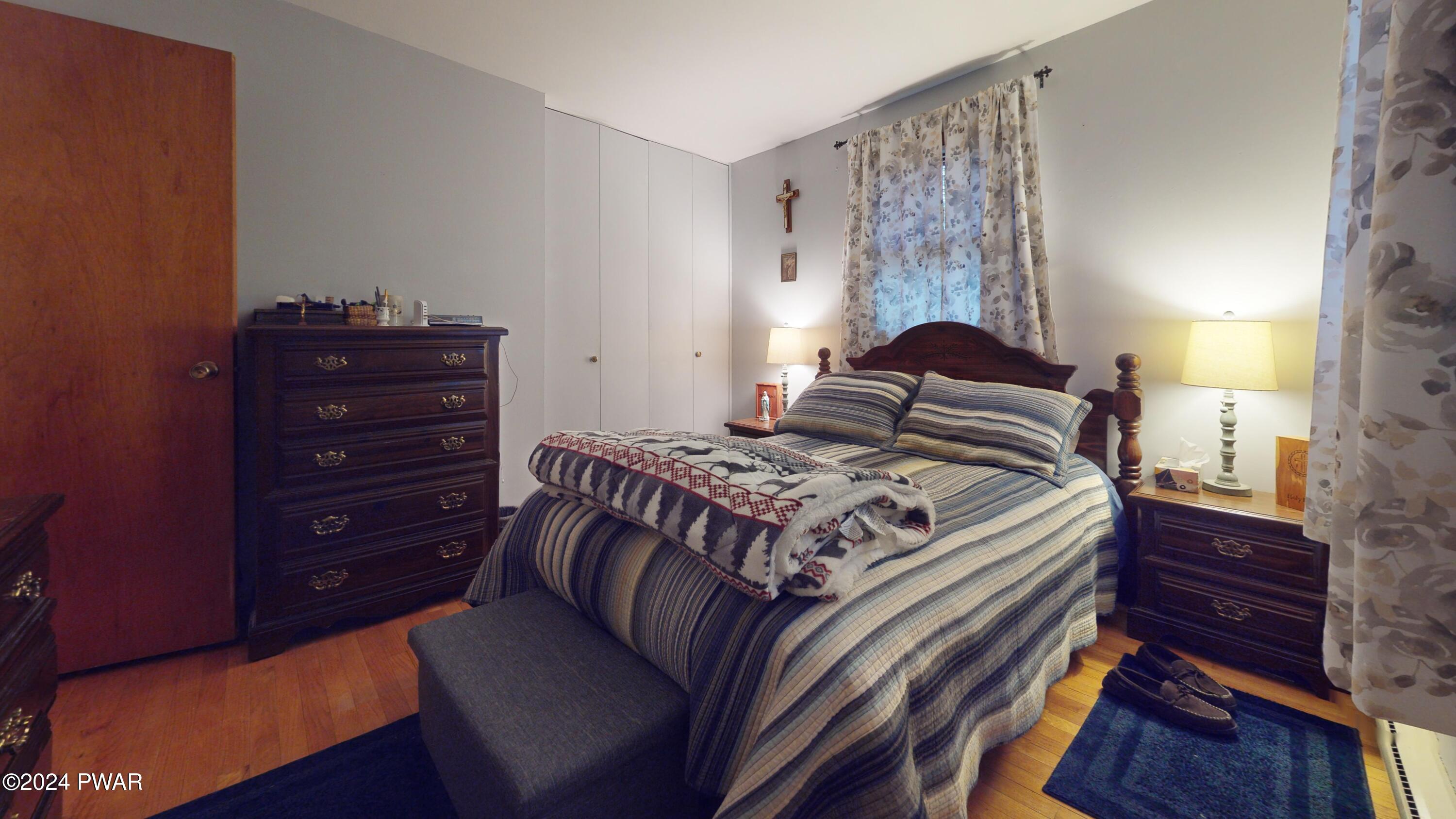 134 Sunnylands Road Milford, PA 18337 - Photo 55 of 59 a bedroom with a bed and a dresser