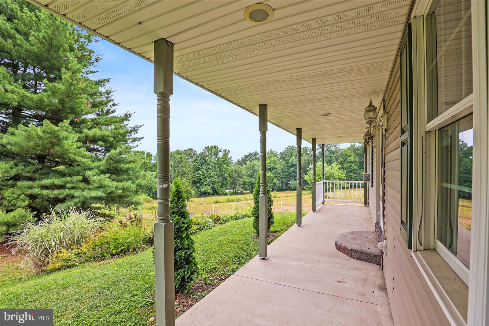 333 Newcomer Road Windsor, PA 17366 - Photo 99 of 112 Serene porch with lush green views.