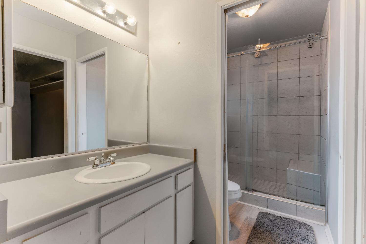 232 Prospect Street Oak View, CA 93022 - Photo 14 of 33 a bathroom with a sink shower and a mirror