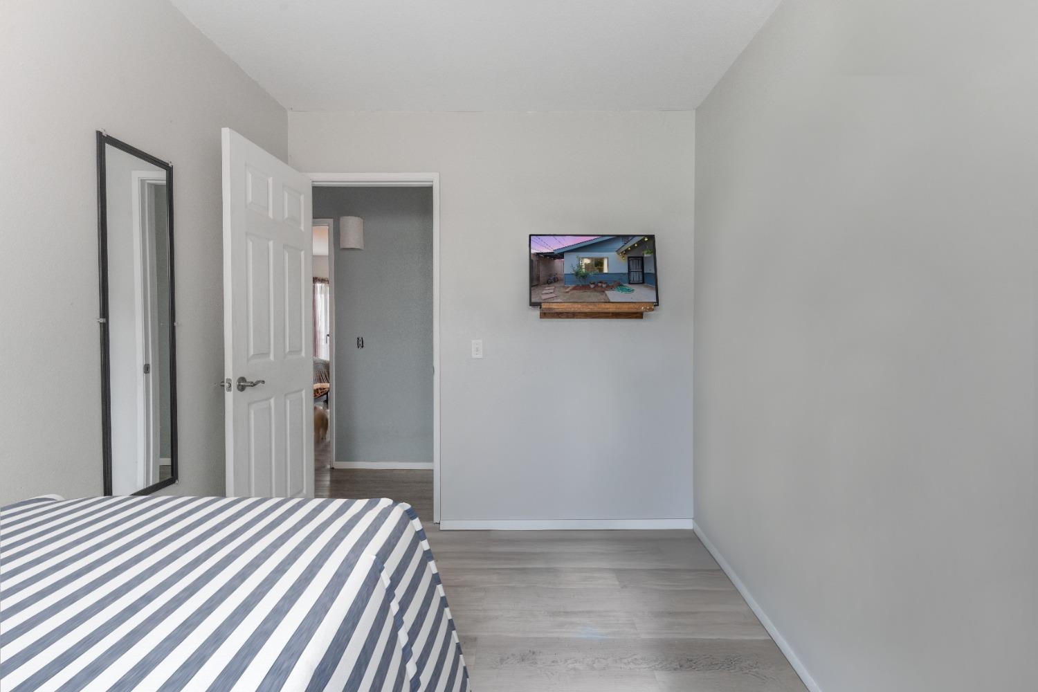 232 Prospect Street Oak View, CA 93022 - Photo 17 of 33 a bedroom with a bed and painting on the wall