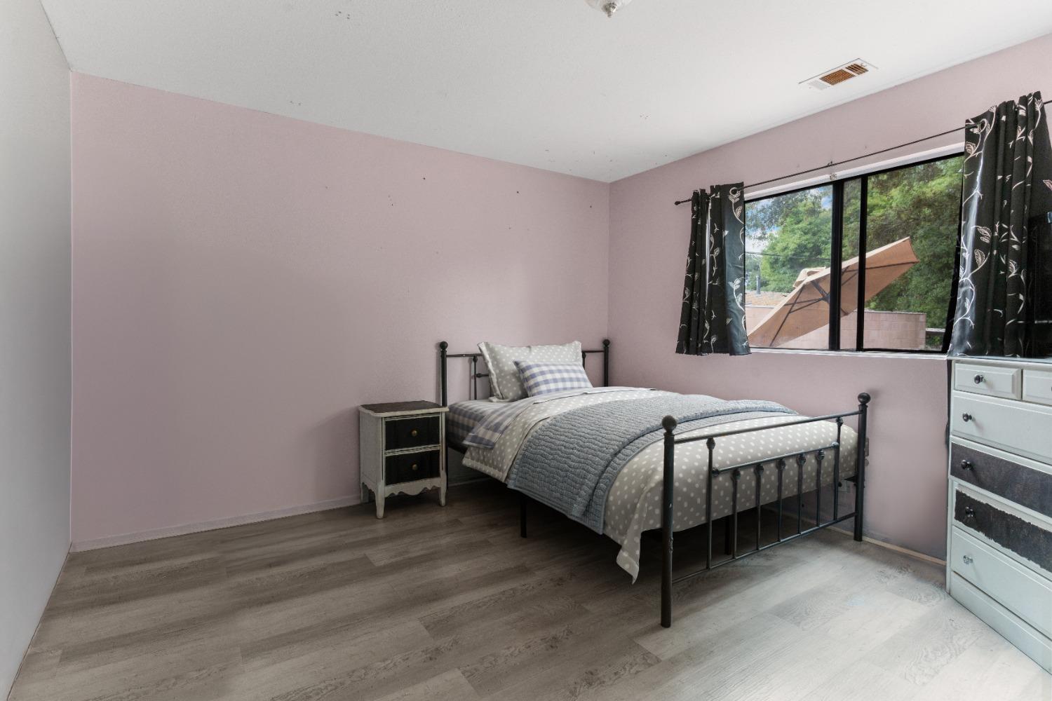 232 Prospect Street Oak View, CA 93022 - Photo 19 of 33 a bedroom with a bed and large window