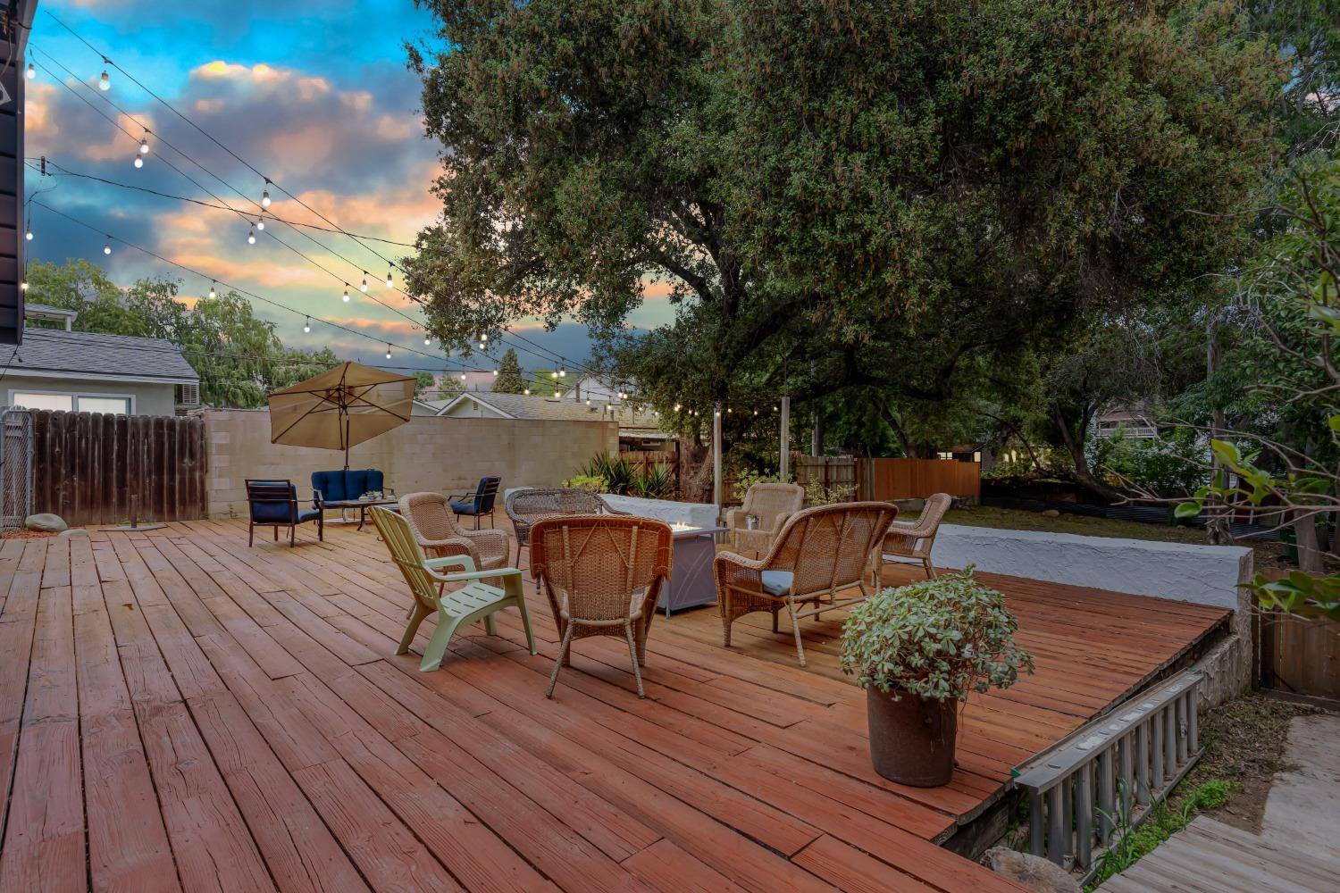 232 Prospect Street Oak View, CA 93022 - Photo 23 of 33 a view of a roof deck with table and chairs and wooden floor