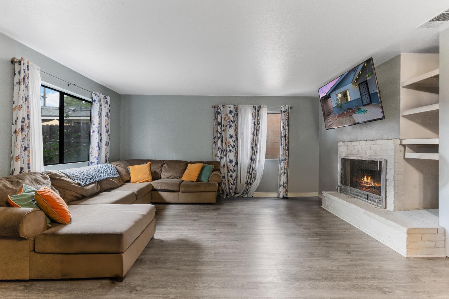 232 Prospect Street Oak View, CA 93022 - Photo 5 of 33 a living room with furniture and a fireplace