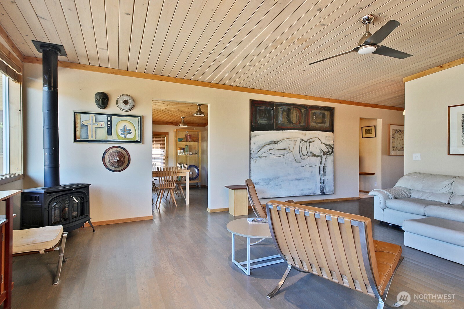 8121 Sandy Hook Terrace Clinton, WA 98236 - Photo 12 of 40 a living room with furniture and a wooden floor