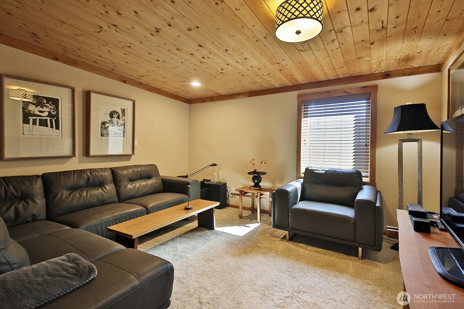 8121 Sandy Hook Terrace Clinton, WA 98236 - Photo 15 of 40 a living room with furniture and a window
