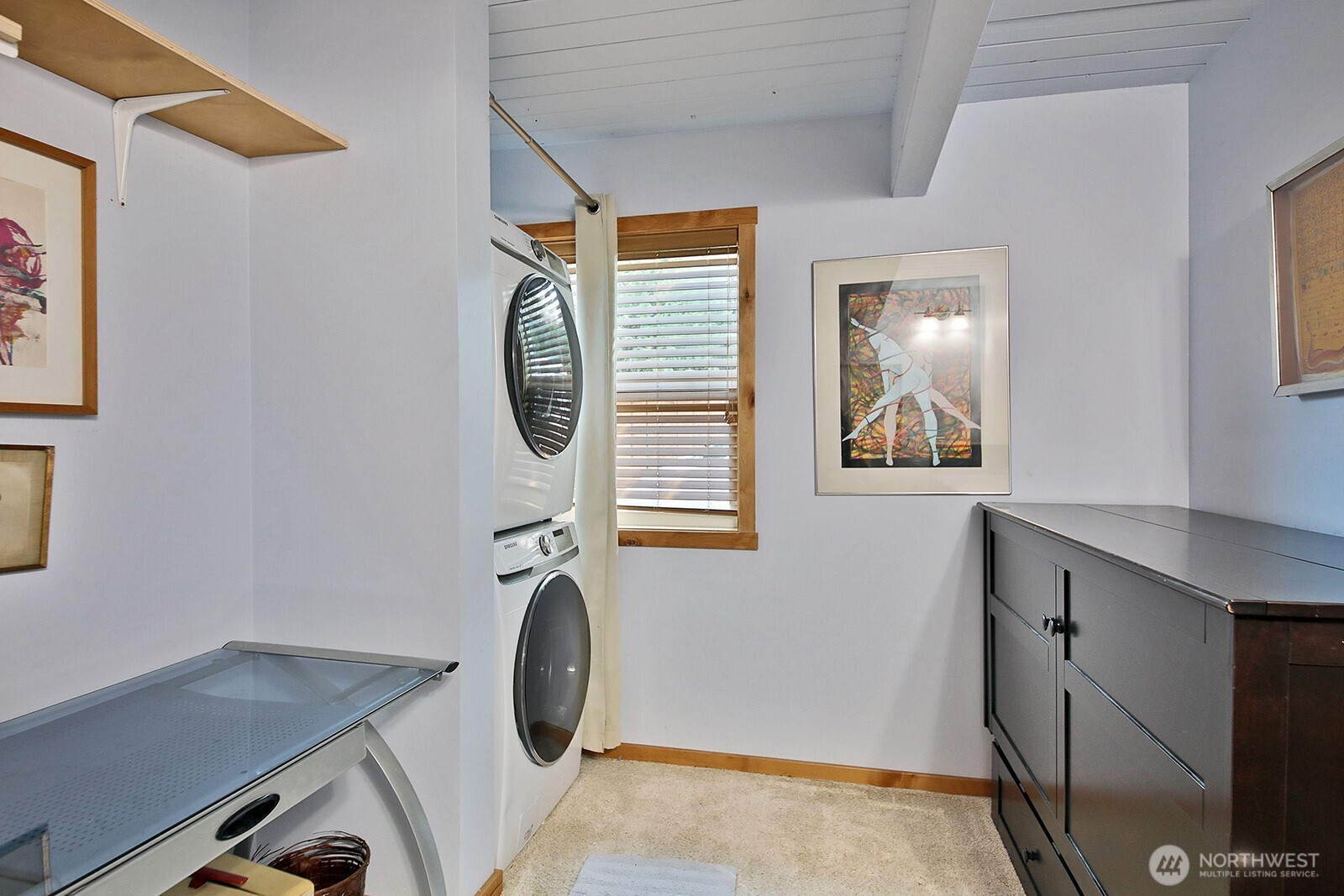 8121 Sandy Hook Terrace Clinton, WA 98236 - Photo 25 of 40 a bathroom with a sink a mirror and a window