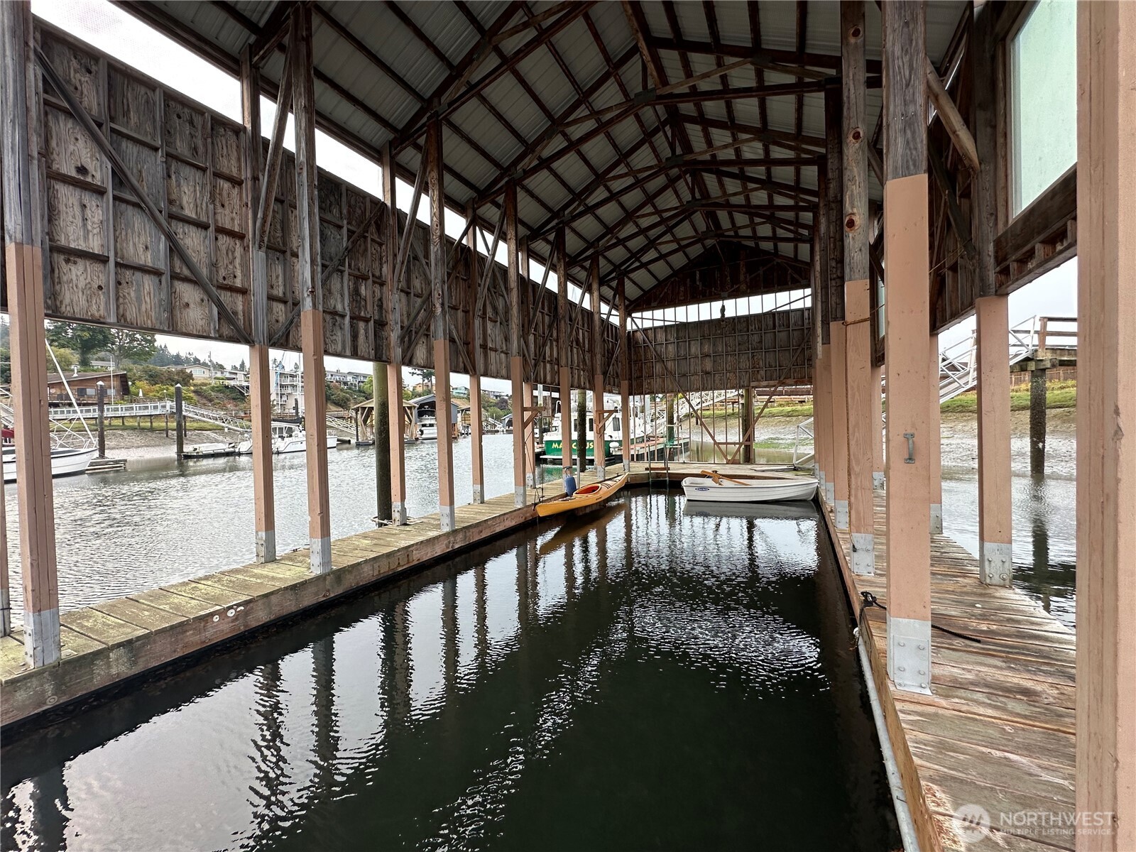 8121 Sandy Hook Terrace Clinton, WA 98236 - Photo 33 of 40 a view of a swimming pool with a porch