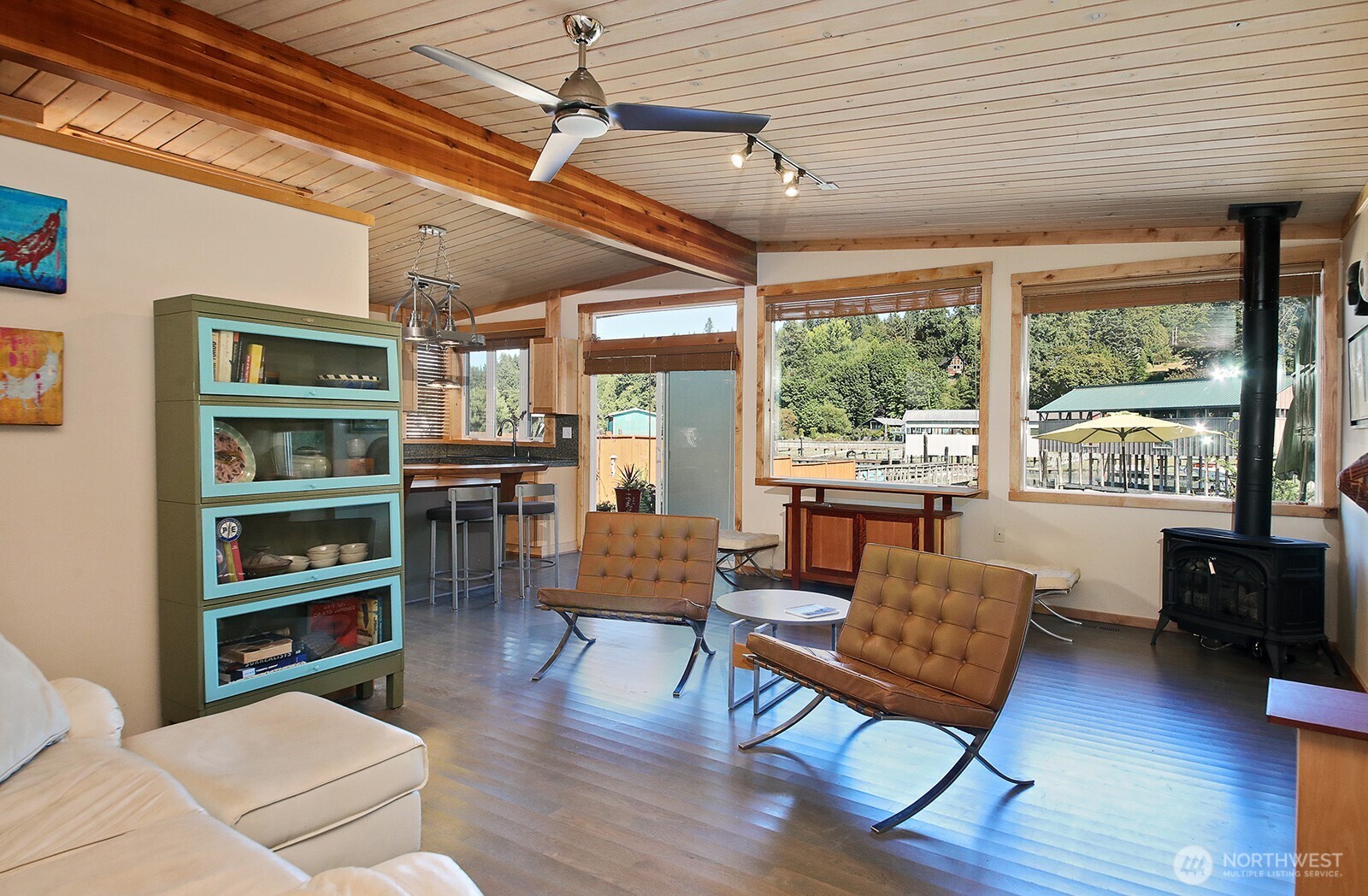 8121 Sandy Hook Terrace Clinton, WA 98236 - Photo 5 of 40 a living room with furniture and a wooden floor