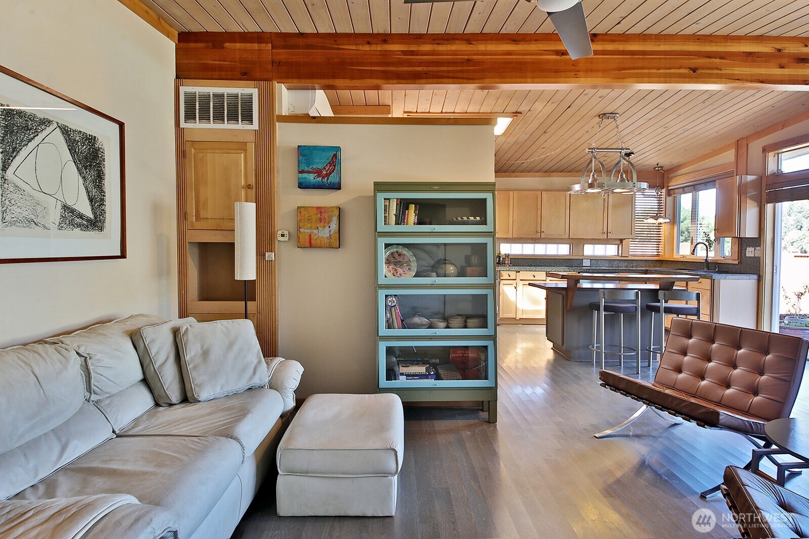 8121 Sandy Hook Terrace Clinton, WA 98236 - Photo 7 of 40 a living room with stainless steel appliances furniture and a kitchen view