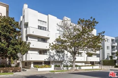 a view of a building with a street