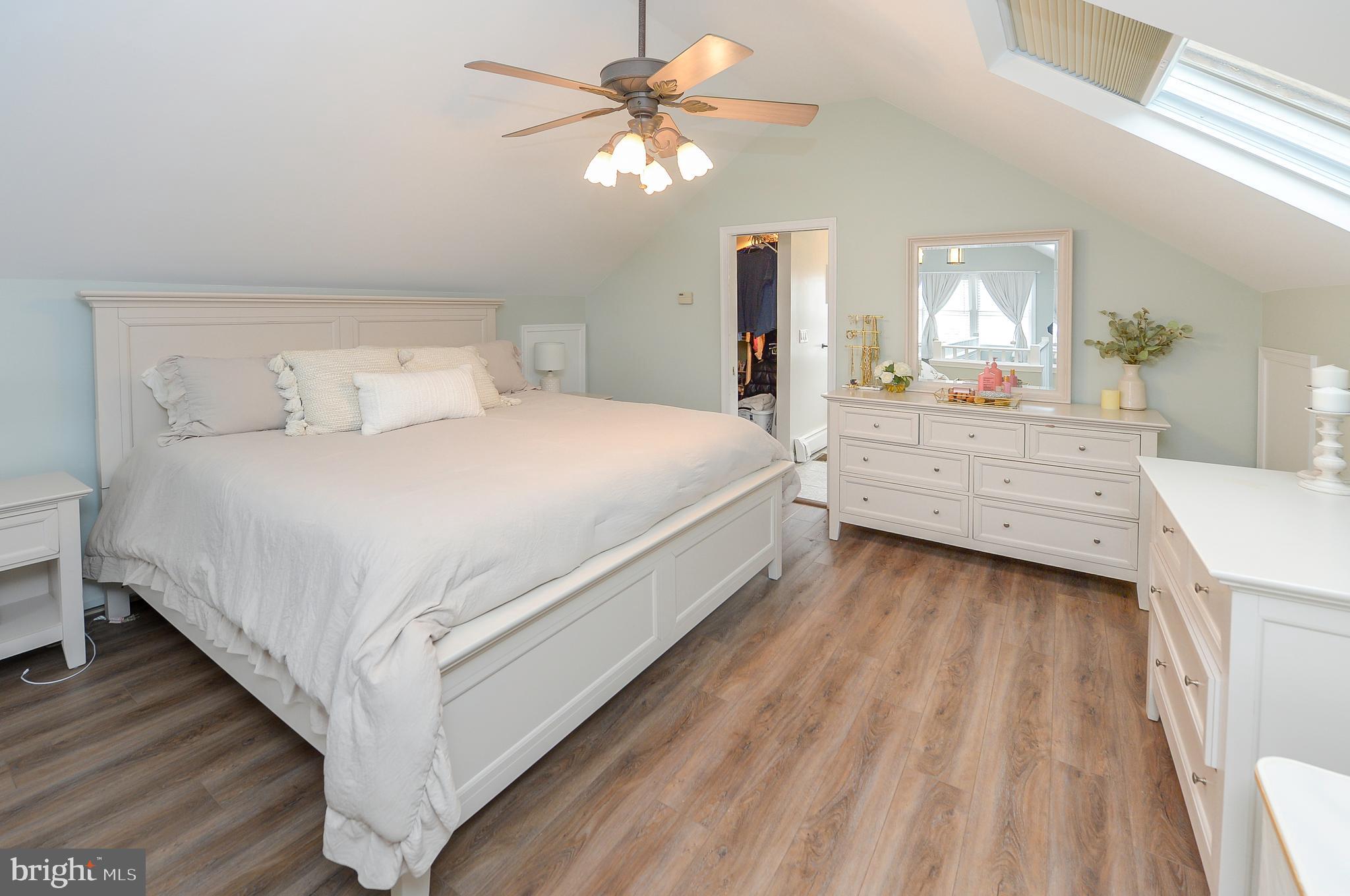1929 Wayne Avenue Haddon Heights, NJ 08035 - Photo 16 of 36 a bedroom with a bed and a chandelier