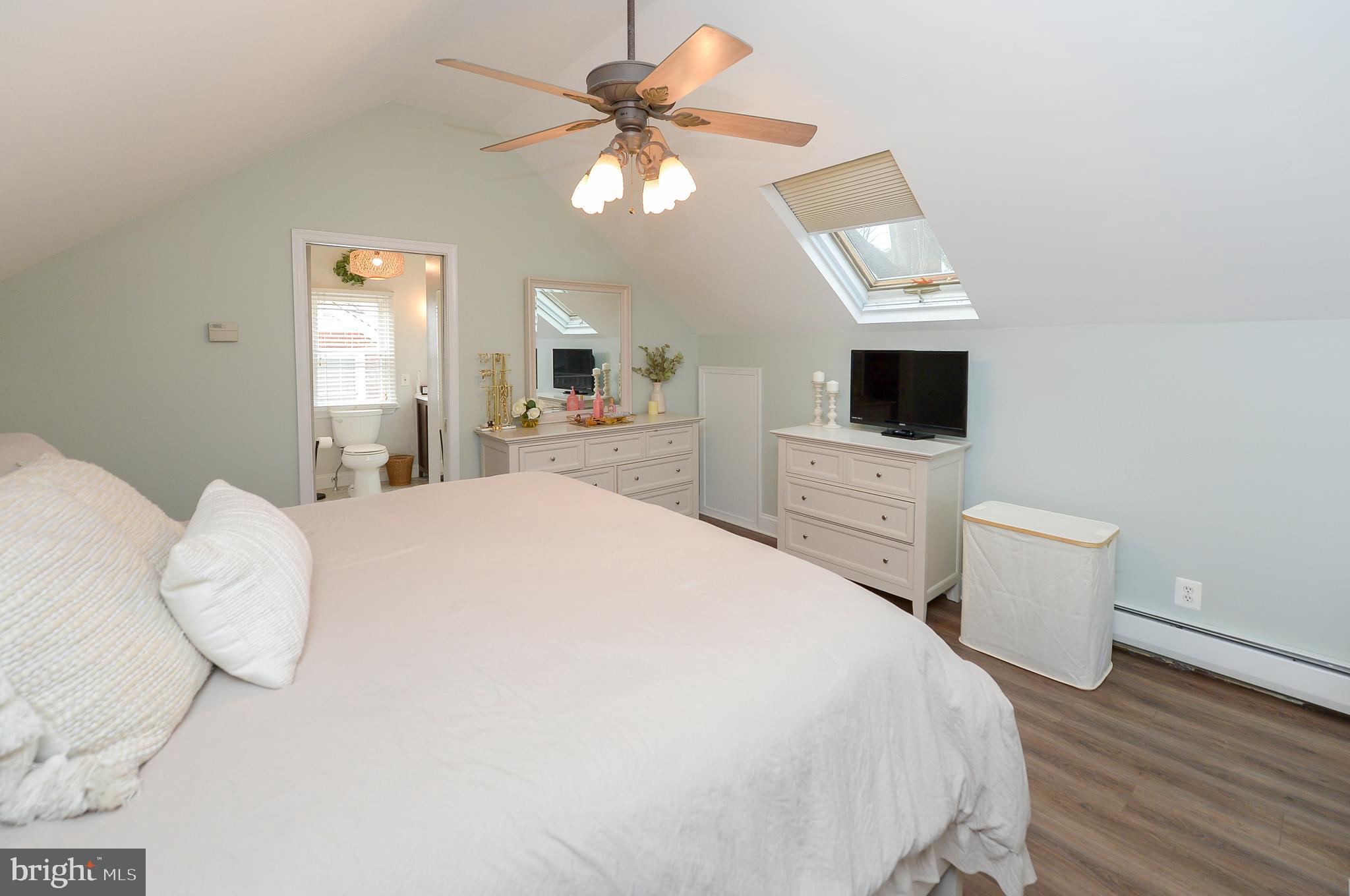 1929 Wayne Avenue Haddon Heights, NJ 08035 - Photo 18 of 36 a spacious bedroom with a bed and a flat screen tv